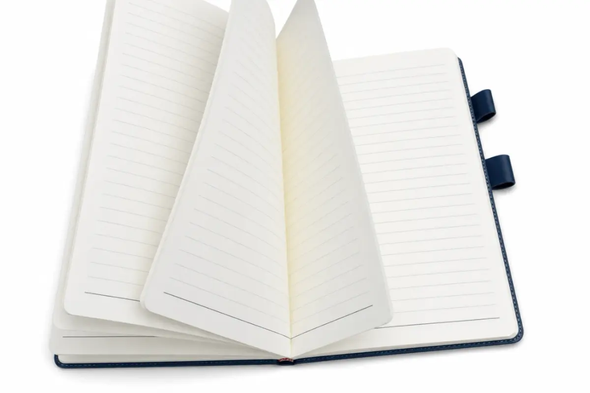 Open bound notebook with lined pages that stay together