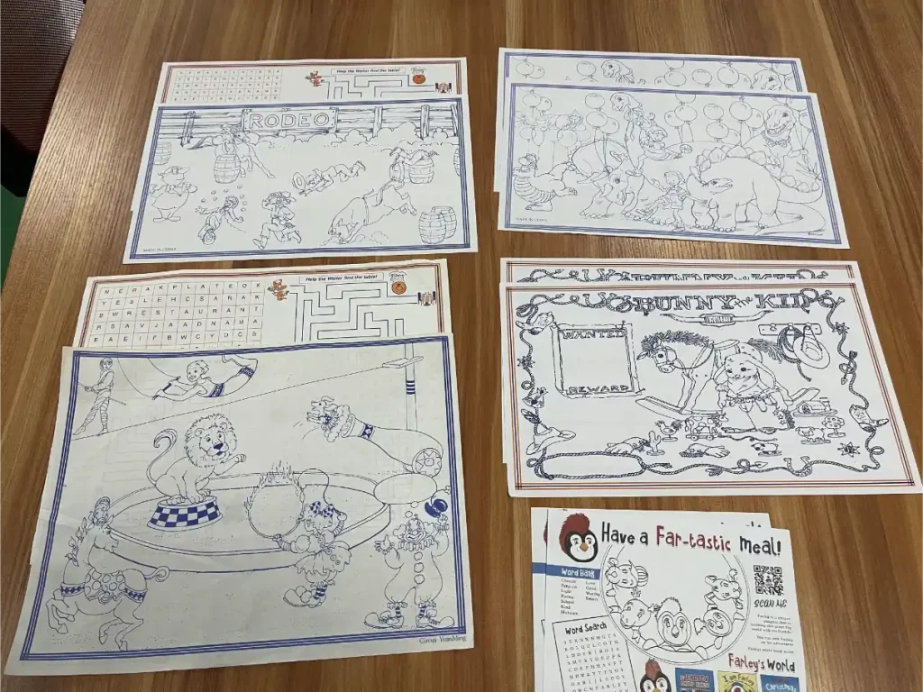 Printed paper placemat with games and promotional content