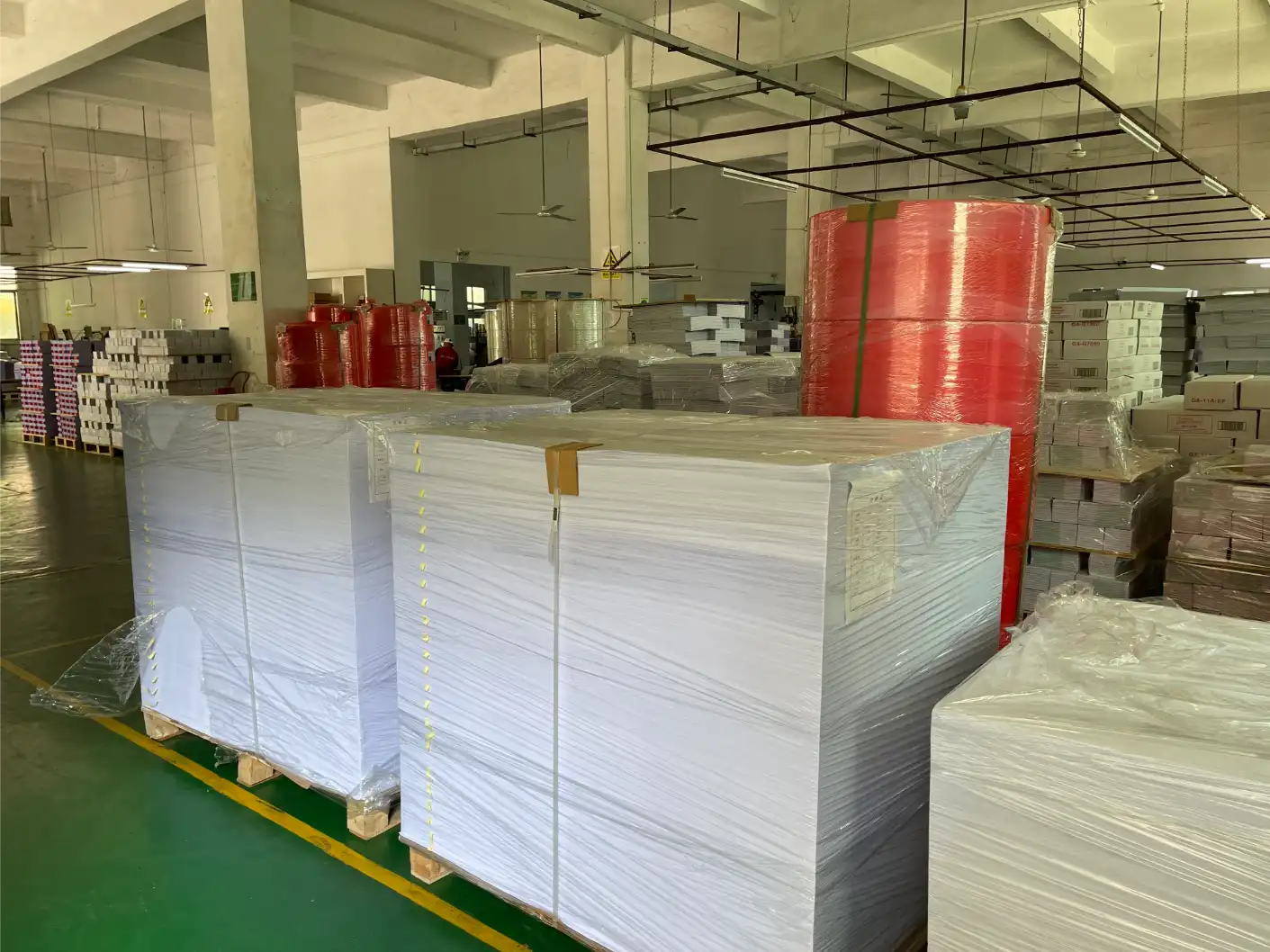 Paper stock stored in Yuanming custom printing company warehouse
