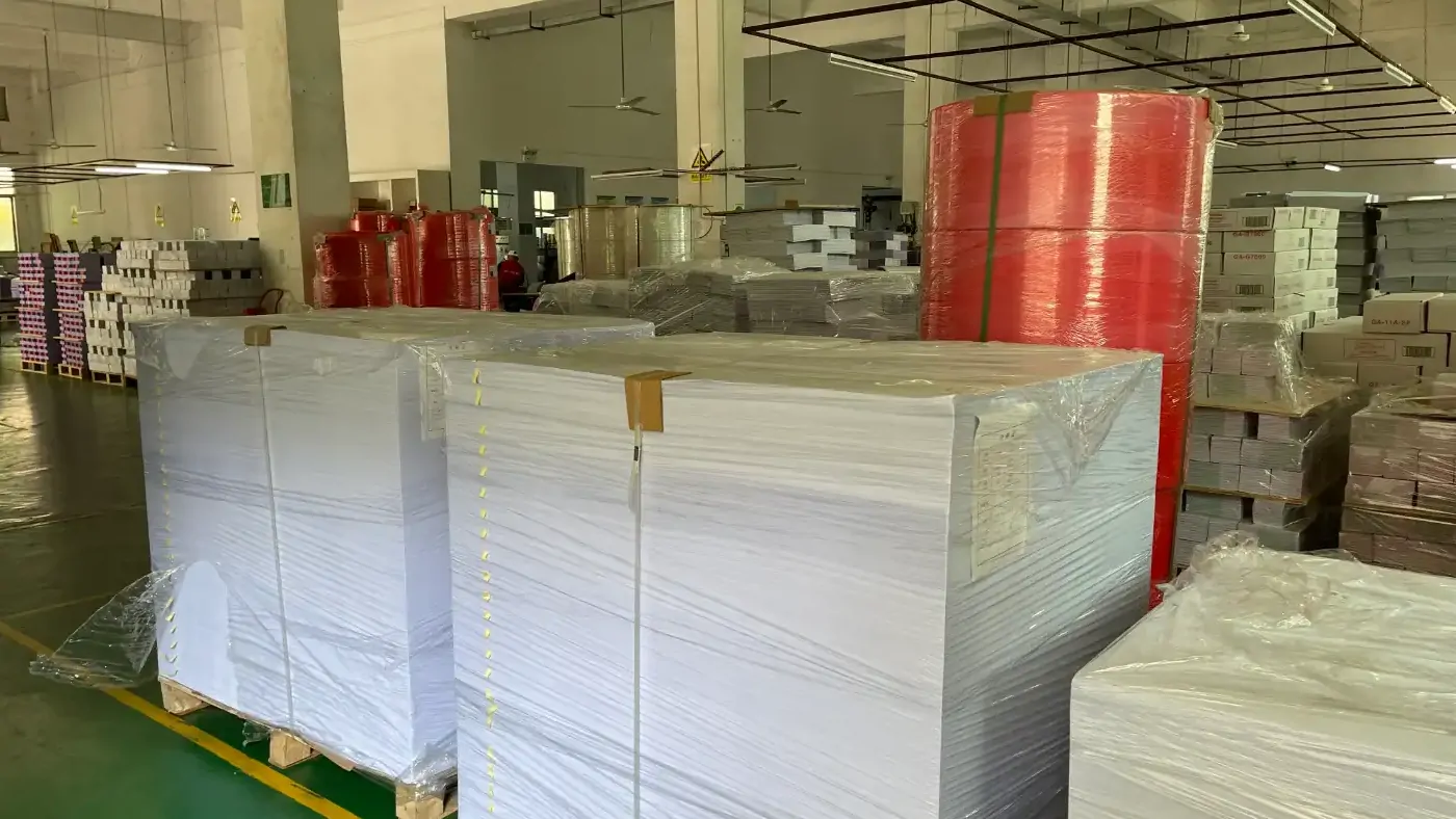 Paper stock staged inside a printing factory warehouse